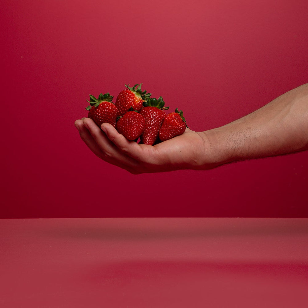 Punets of freshly picked organic strawberries.